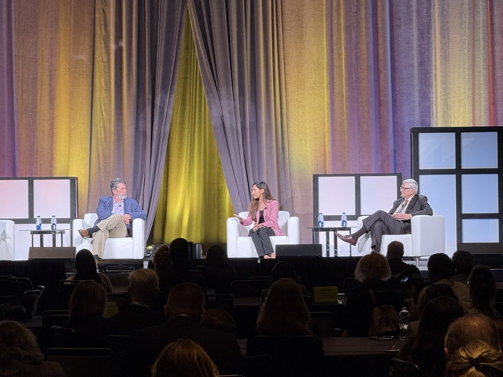 Dr. Mewawalla in a panel discussion on a main stage